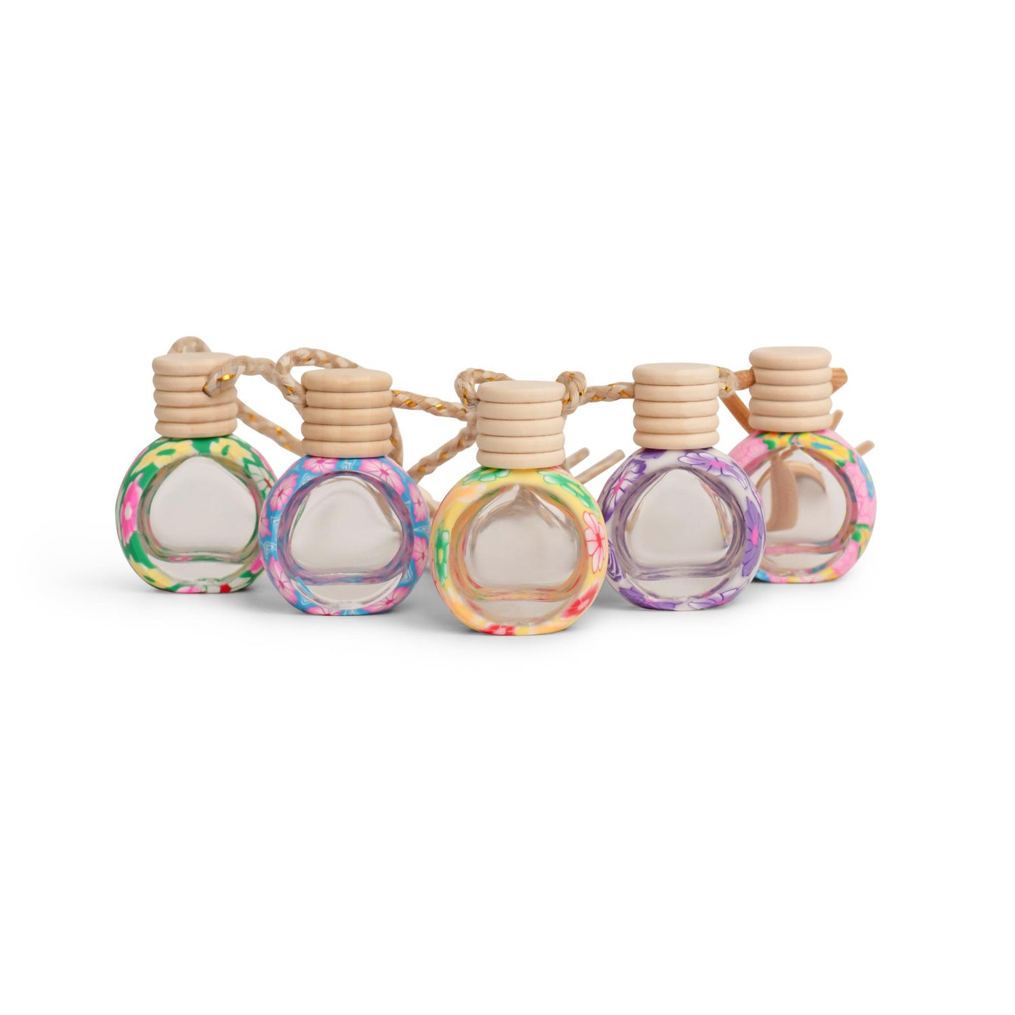 A set of colorful hanging clay car diffusers with floral patterns.